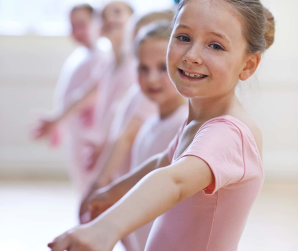 Group Of Young Girls In Ballet Dancing Class